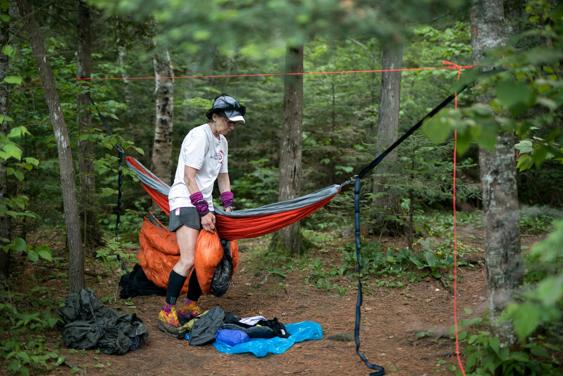 After arriving in camp at about 8:30p.m. with a long 20 mile day behind her, Melanie McManus, exhausted and dehydrated, sets up her camp near the Manitou River.