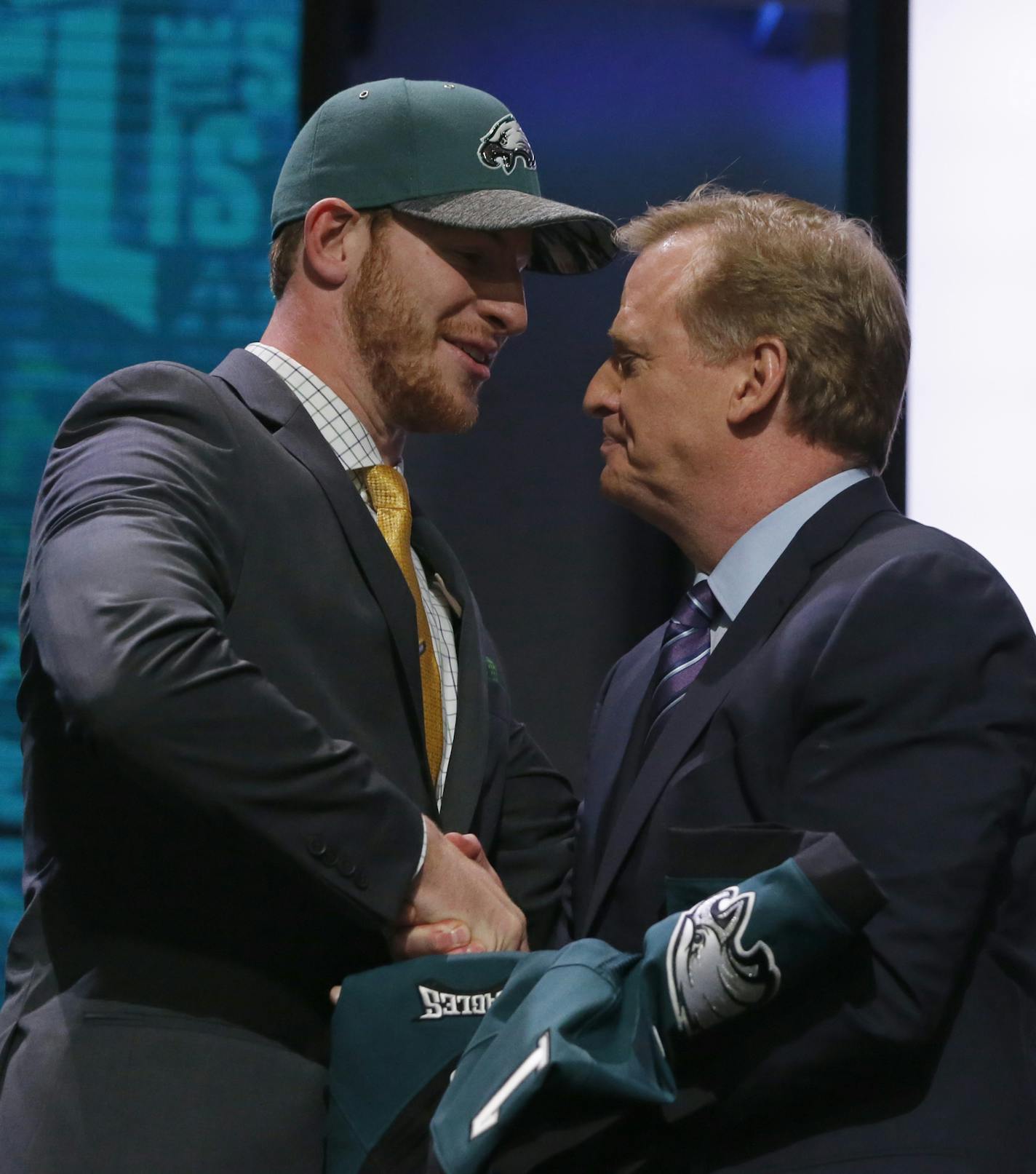 North Dakota State&#x2019;s Carson Wentz shakes hands with NFL commissioner Roger Goodell after being selected by Philadelphia Eagles as second pick in the first round of the 2016 NFL football draft, Thursday, April 28, 2016, in Chicago. (AP Photo/Charles Rex Arbogast)