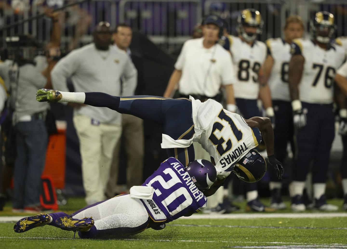 Vikings cornerback Mackensie Alexander (20) was penalized for a horse collar tackle when he brought down Los Angeles Rams wide receiver Mike Thomas (13) on the opening kickoff return in the first quarter.