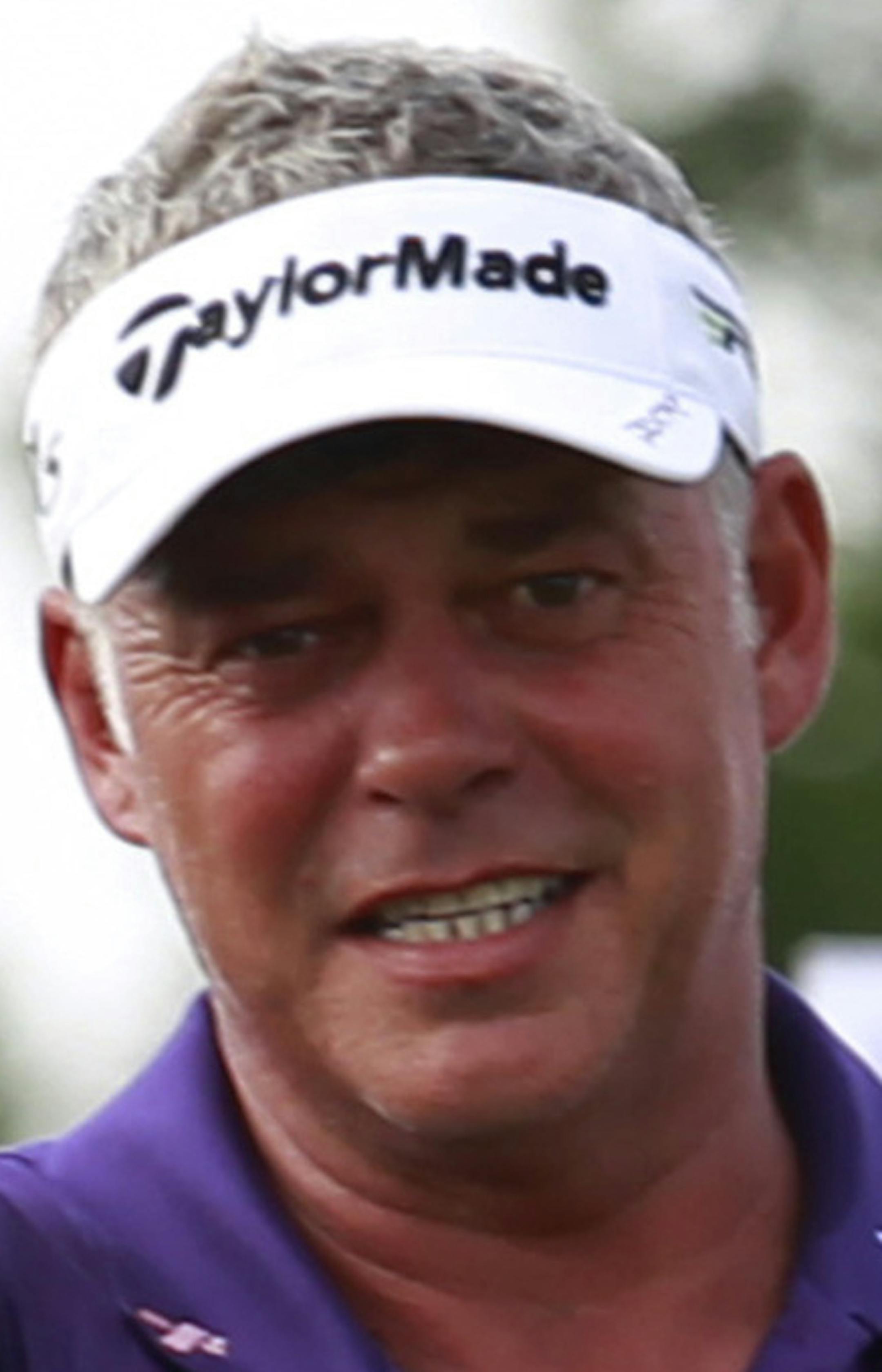Northern Ireland's professional golfer Darren Clarke gestures during the first round of the World Celebrity Pro-Am golf tournament in Haikou, in southern China's island province Hainan on Saturday Oct. 20, 2012. (AP Photo/Eugene Hoshiko) ORG XMIT: XEH146