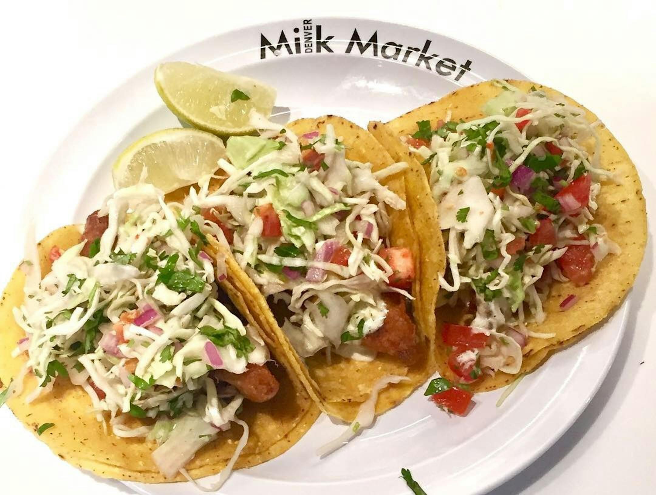 Fish tacos are served up by Albina by the Sea, one of the vendors at the Denver Milk Market, one of a growing number of food halls to open in the Denver area.