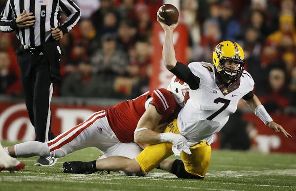 Minnesota Golden Gophers quarterback Mitch Leidner (7)was tackled by Wisconsin Badgers linebacker Vince Biegel (47) in the third quarter Saturday Nove