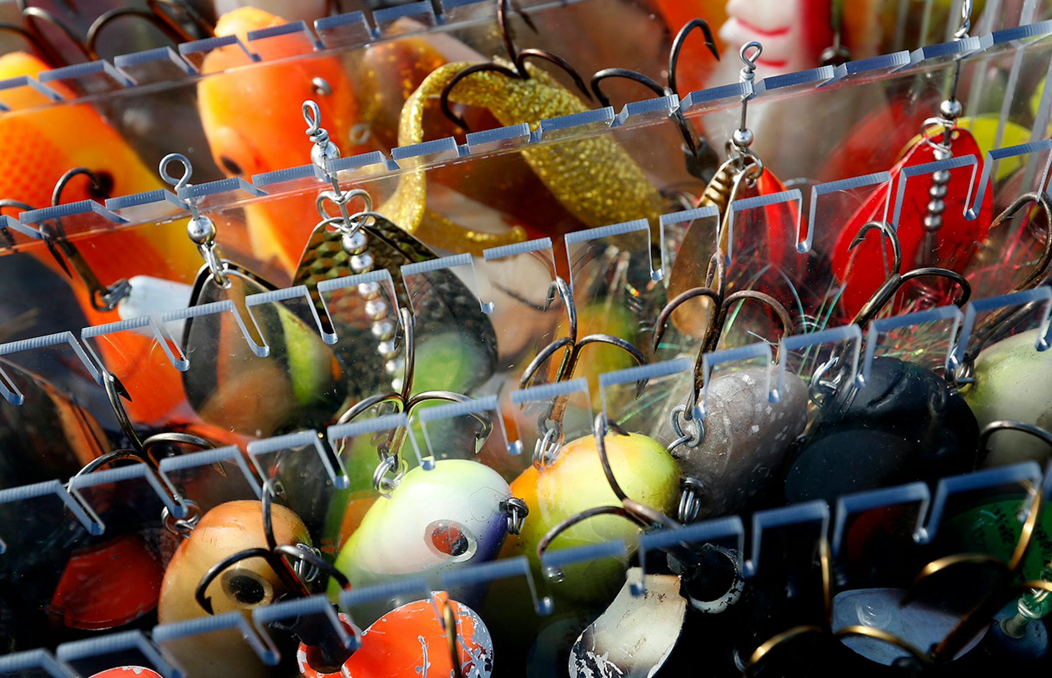 Fishing guide Travis Frank uses a variety of lures to fish for Muskie.