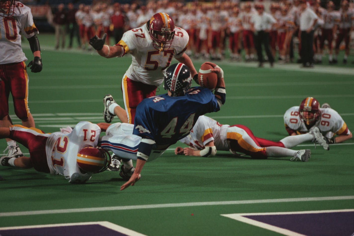 Mora's #44, Travis Lagasse, scores the game's only touchdown on an eight yard run, falling on the goal-line with the ball across the white stripe. #21, Mark Mokoff made the tackle just a little late for Northfield as #57, Chad Setterstrom came up to help.