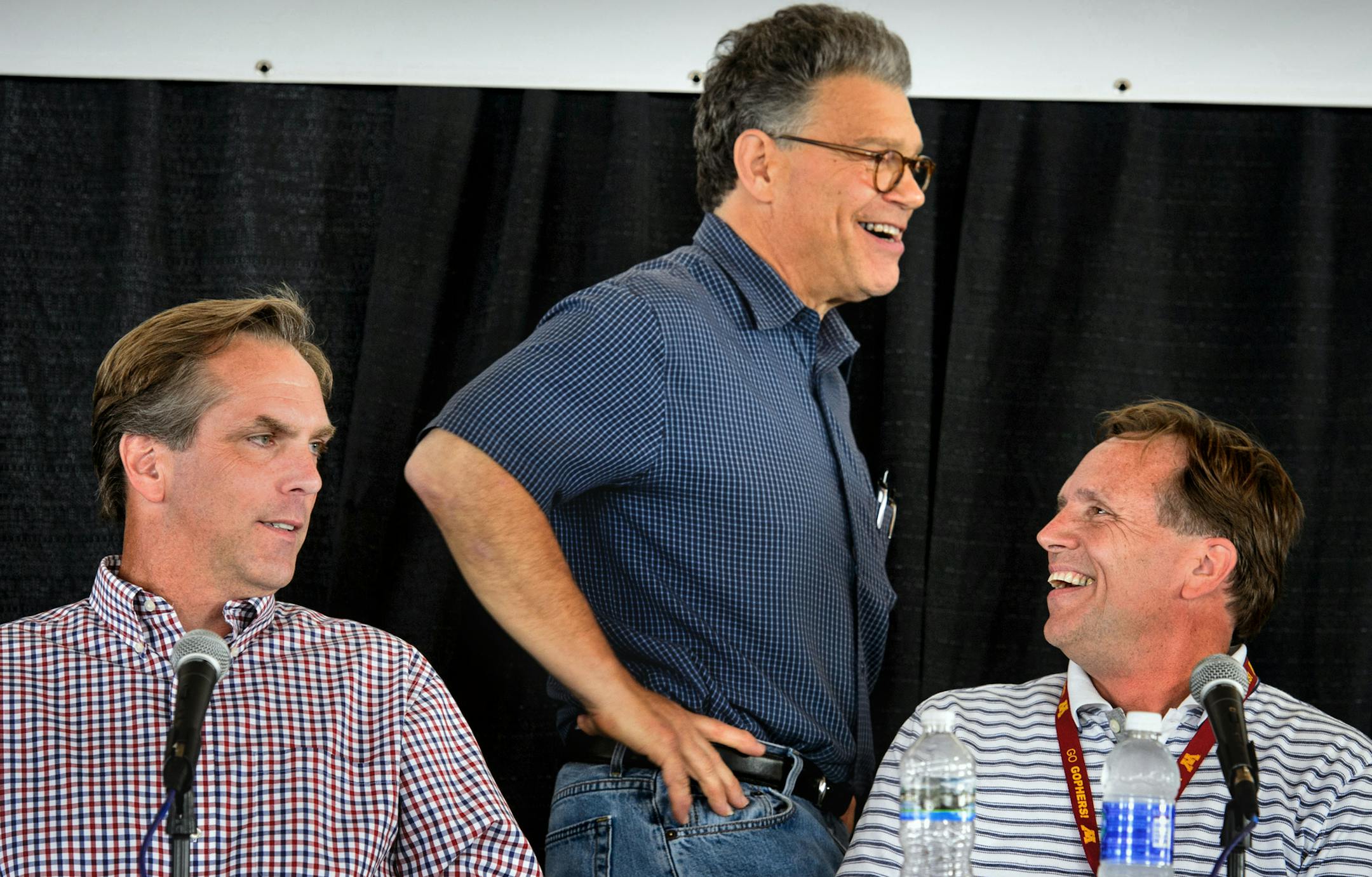 Senator Al Franken stood to greet his main opponents Mike McFadden and Jim Abler during a break during the Farmfest U.S. Senate Candidate's forum on agriculture and rural issues ] Wednesday, August 6, 2014. GLEN STUBBE * gstubbe@startribune.com ORG XMIT: MIN1408061604453264