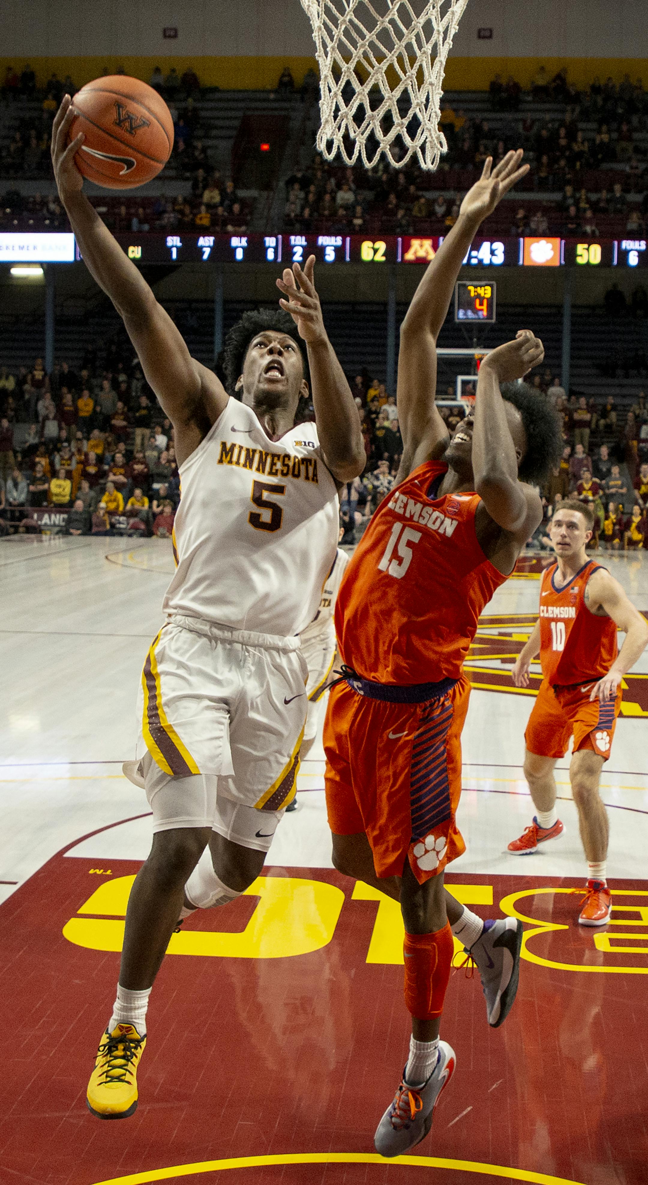 Minnesota guard Marcus Carr (5) drove to the basket while defended by Clemson guard John Newman III (15) in the second half. ] CARLOS GONZALEZ • cgonzalez@startribune.com – Minneapolis, MN – December 2, 2019, Williams Arena, NCAA Basketball, University of Minnesota vs. Clemson Tigers