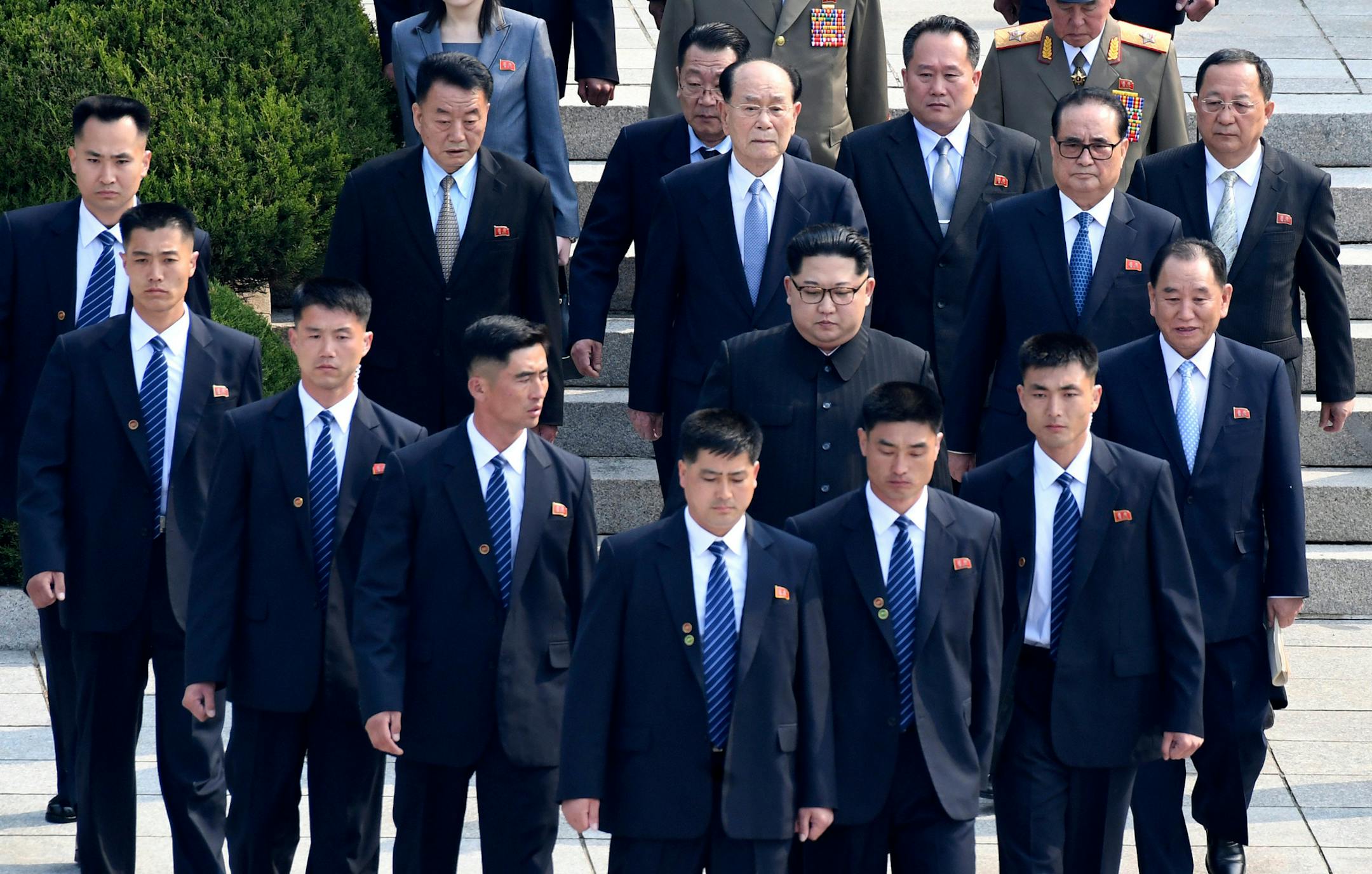 North Korean leader Kim Jong Un, center, is surrounded by his security guards upon his arrival for a meeting with South Korean President Moon Jae-in at the North Korea side of Panmunjom in the Demilitarized Zone, South Korea, Friday, April 27, 2018. (Korea Summit Press Pool via AP)