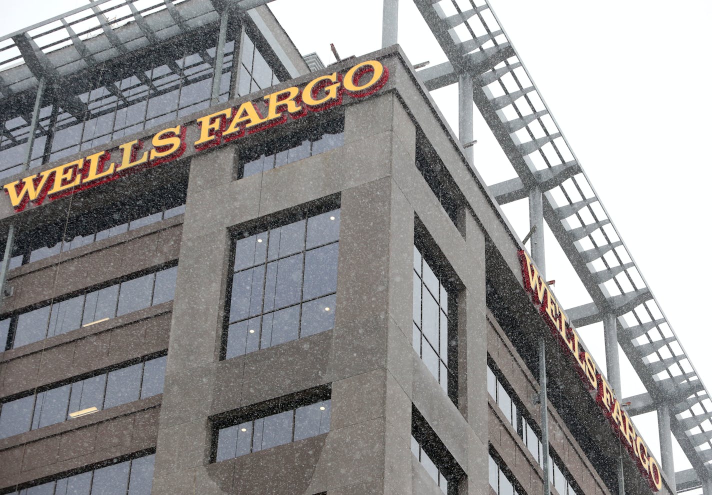 A street view shows signage at the top of the Wells Fargo towers.