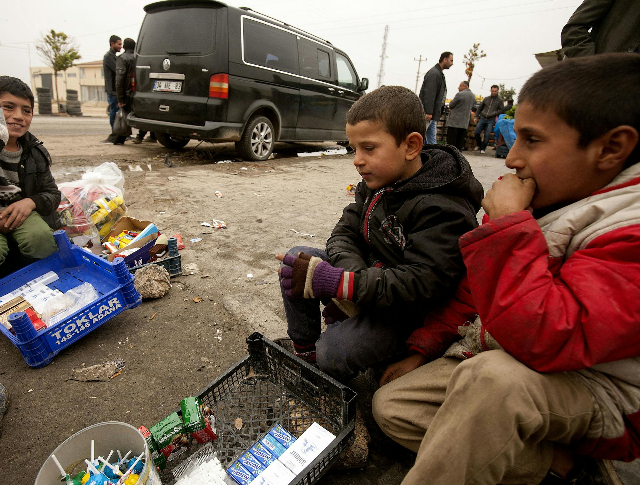 Kurdish children sell snacks and gum on the street near the camp in Urfa, Turkey. (Mitchell Prothero/McClatchy DC/TNS)