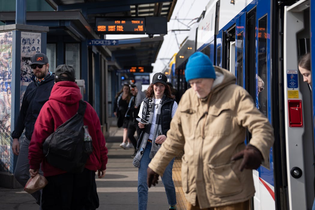 Fans exit light-rail trains on a warm sunny day before the Minnesota United home opening game at Allianz Field in St. Paul on March 2.
