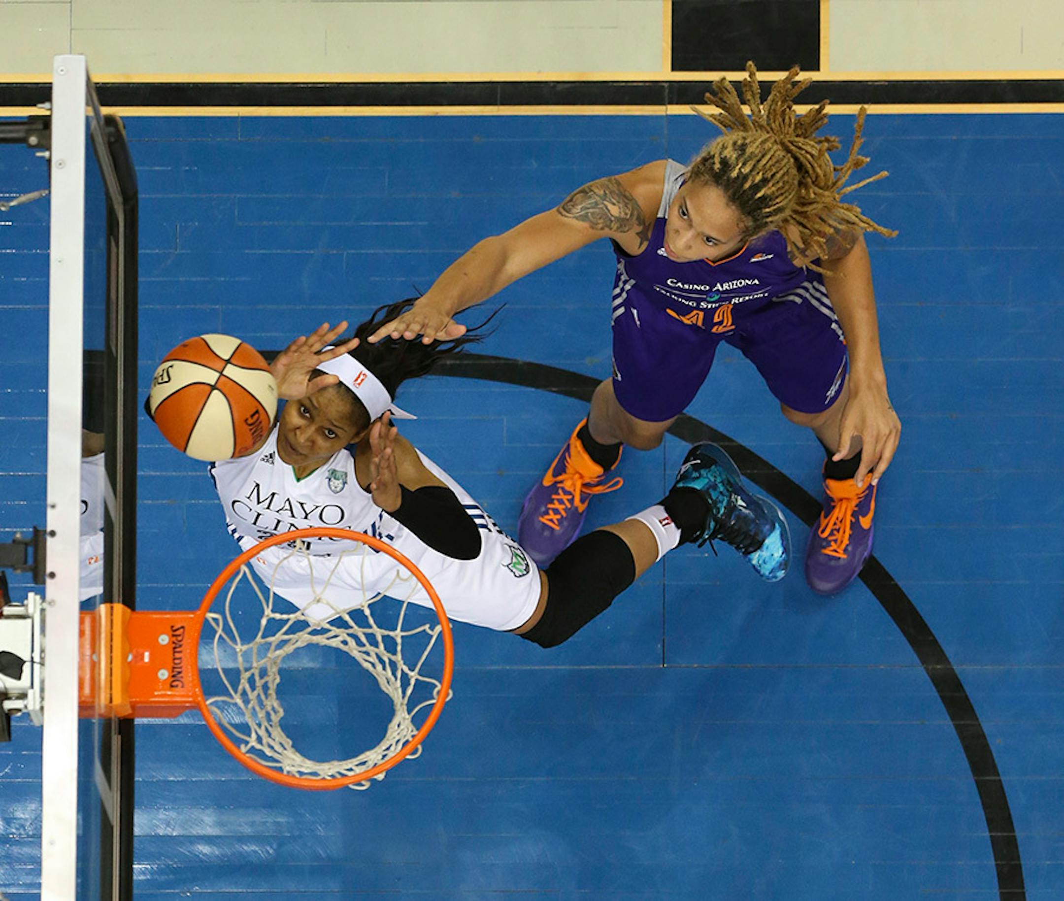 Lynx forward Maya Moore (23) tried to tip in a first half shot while defended by Phoenix Mercury center Brittney Griner (42) Thursday night at Target Center.