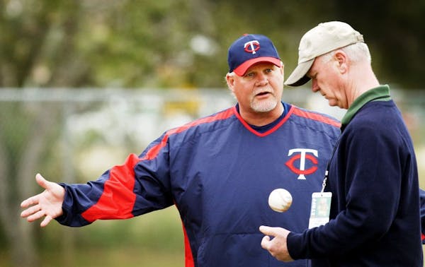 Ron Gardenhire, left, and general manager Terry Ryan talk during spring training last year.