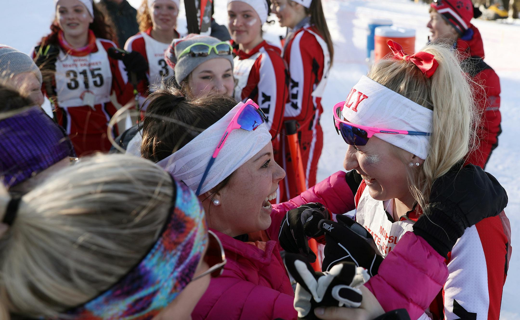 Skier Erin Bianco, right, of Ely gets a hug from her friend Anna following the girl's 5K classical race Thursday. ] ANTHONY SOUFFLE ï anthony.souffle@startribune.com High school skiers competed during the nordic skiing state meet Thursday, Feb. 16, 2017 at Giants Ridge in Biwabik, Minn.