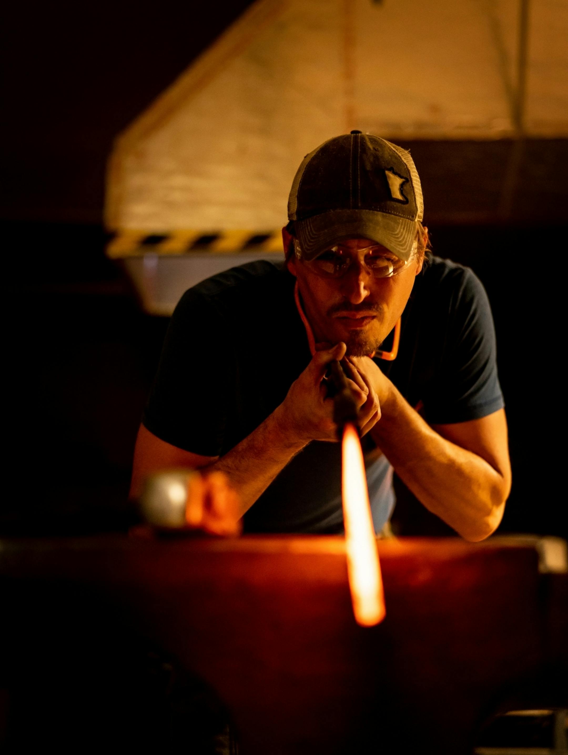 Jason Kraus checked the straightness of his forged blade.