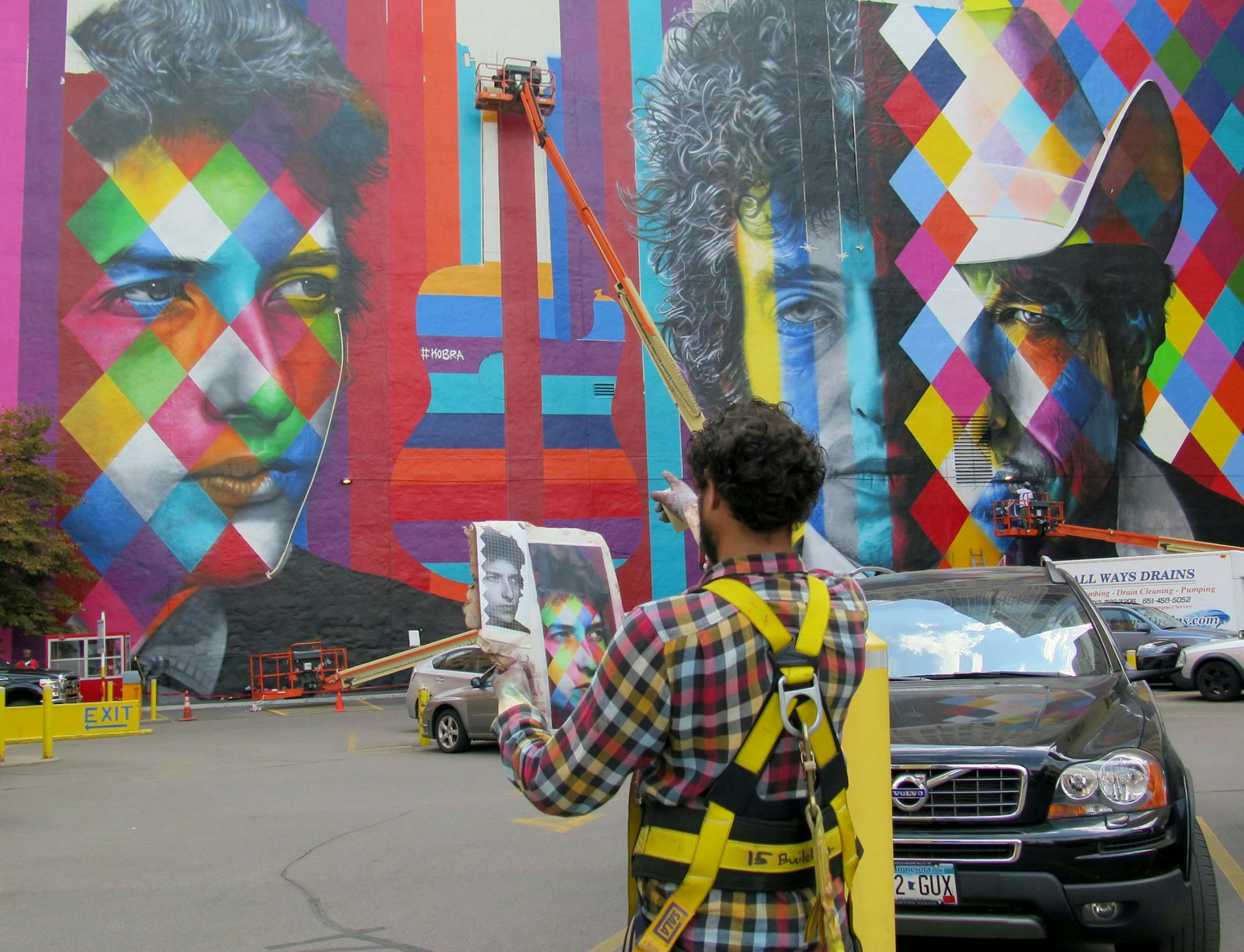 The Bob Dylan mural nears completion, Friday, Sept. 04, as one of the artists steps back to check his work.