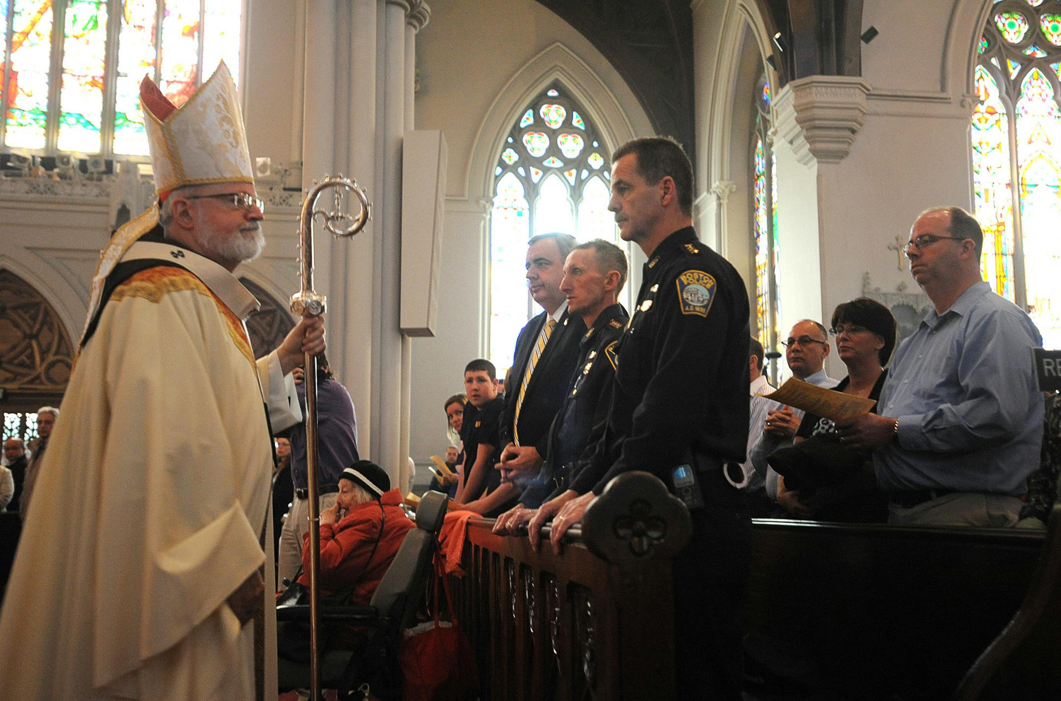 Cardinal Sean O'Malley celebrates Mass at the Cathedral of The Holy Cross, in Boston, honoring victims from Boston Marathon bombings and the death of MIT Officer, Sean Collier Sunday, April 21, 2013. (AP Photo/Boston Herald, Faith Ninivaggi)