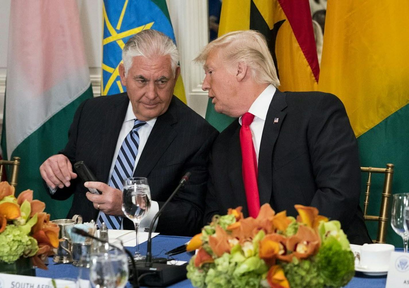 FILE -- President Donald Trump talks with Secretary of State Rex Tillerson at the Palace Hotel in New York, Sept. 20, 2017.