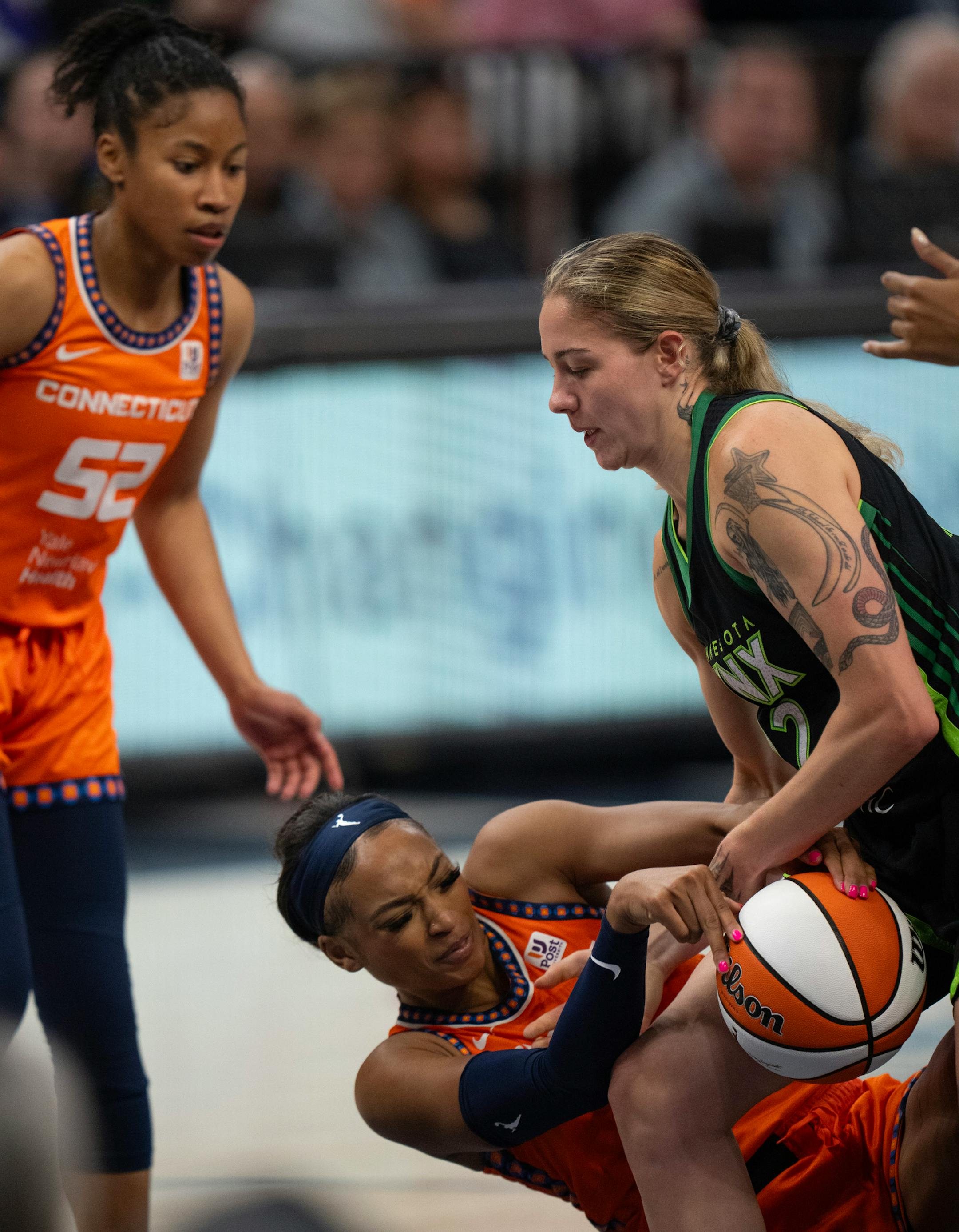 Connecticut Sun guard DiJonai Carrington (21) and Minnesota Lynx forward Emily Engstler fought for the ball in the third quarter Thursday night. The Minnesota Lynx lost to the Connecticut Sun 89-68 in a WNBA game Thursday night, June 22, 2023 at Target Center in Minneapolis.