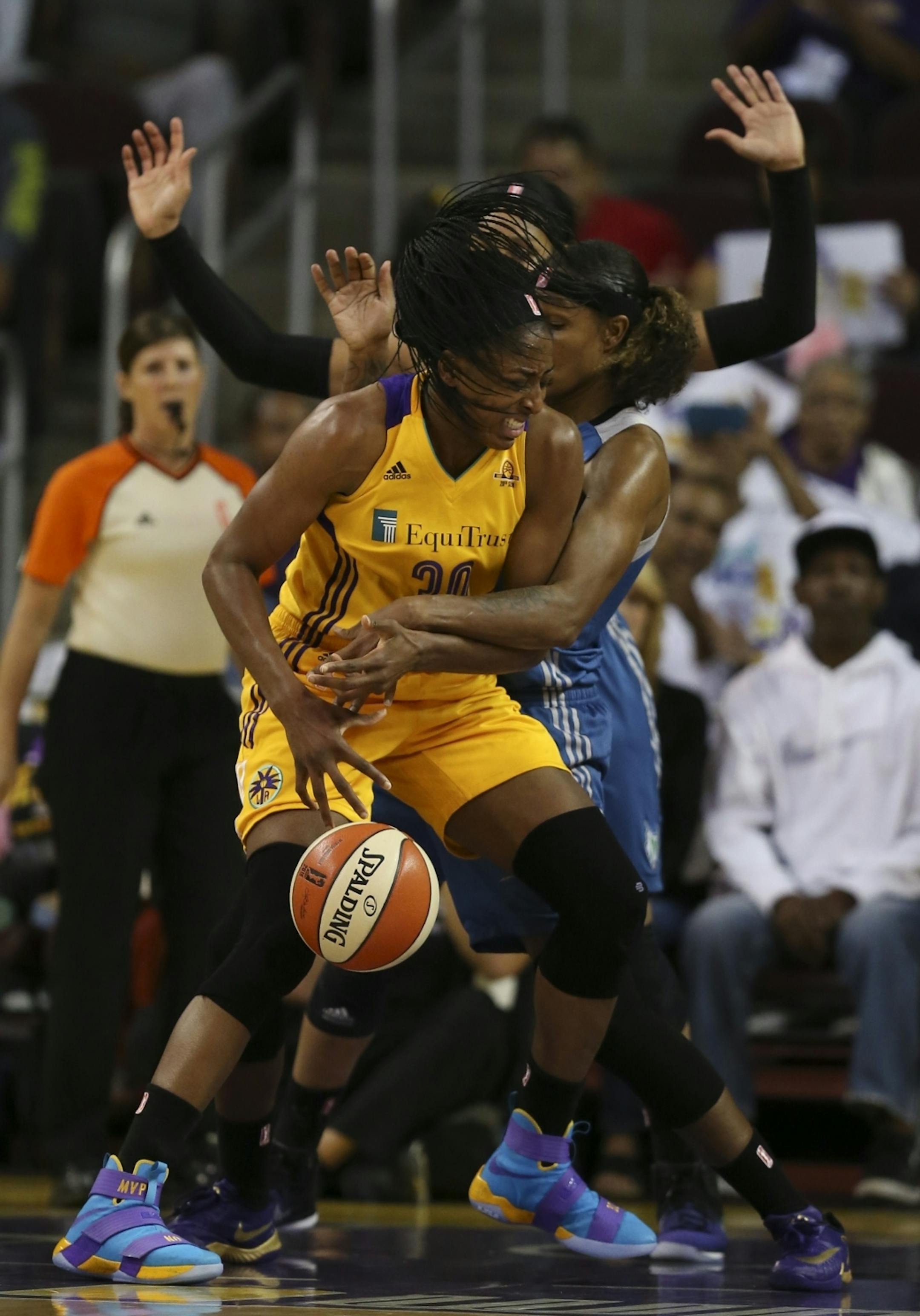 Minnesota Lynx forward Rebekkah Brunson (32) defended Los Angeles Sparks forward Nneka Ogwumike (30) under the Sparks net in the second quarter.