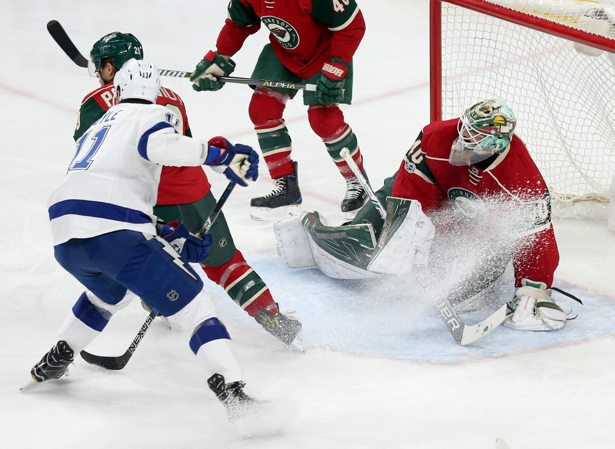 Minnesota Wild goalie Devan Dubnyk (40) denies a shot by Tampa Bay's Brian Boyle (11) in the first period Friday, Feb. 10, 2017, at the Xcel Energy Center in St. Paul, MN.