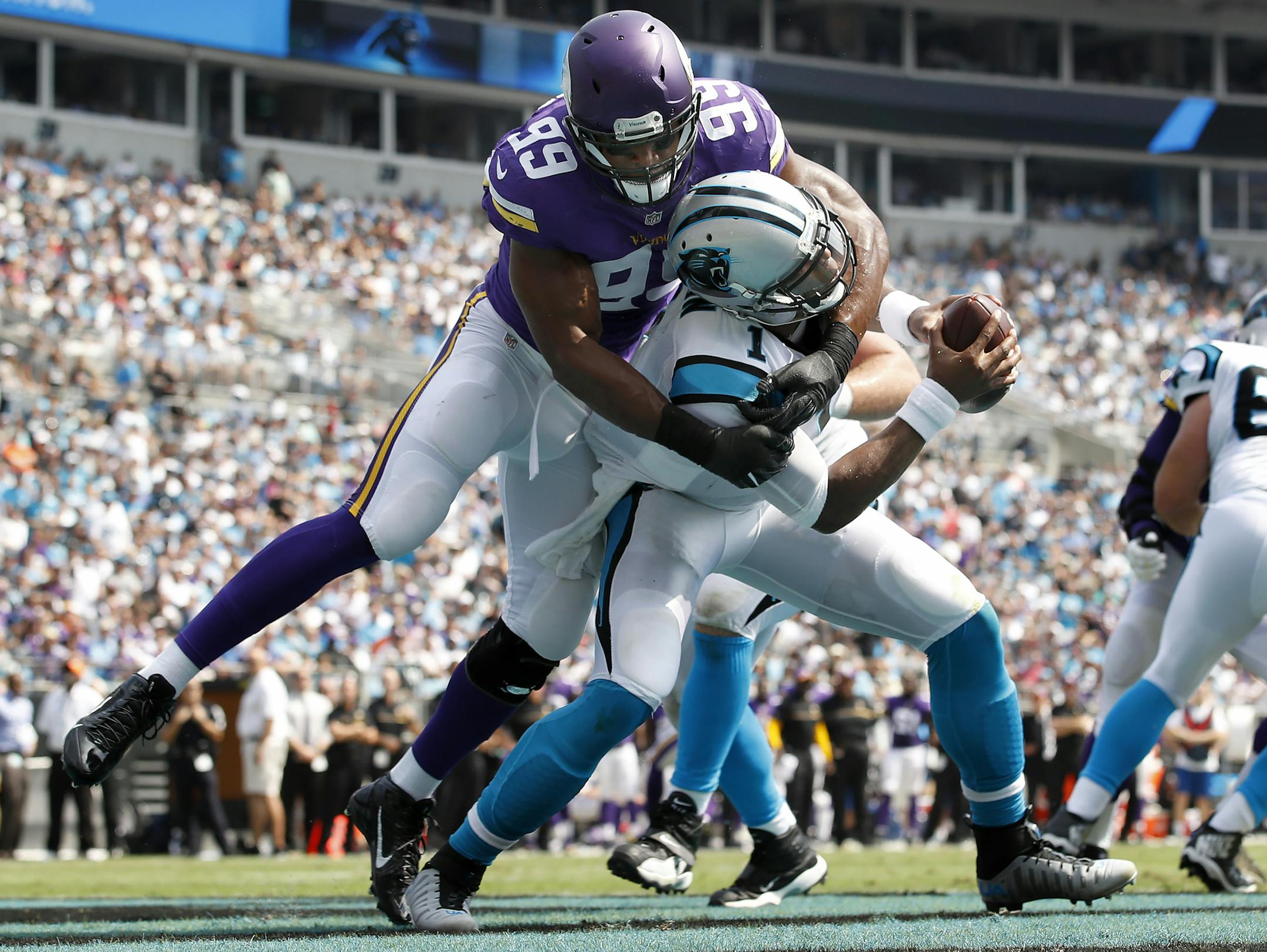 Danielle Hunter (99) sacked Cam Newton (1) in the end zone for a safety in the first quarter. ] CARLOS GONZALEZ cgonzalez@startribune.com - September 25, 2016, Charlotte, NC, Bank of America Stadium, NFL, Minnesota Vikings vs. Carolina Panthers