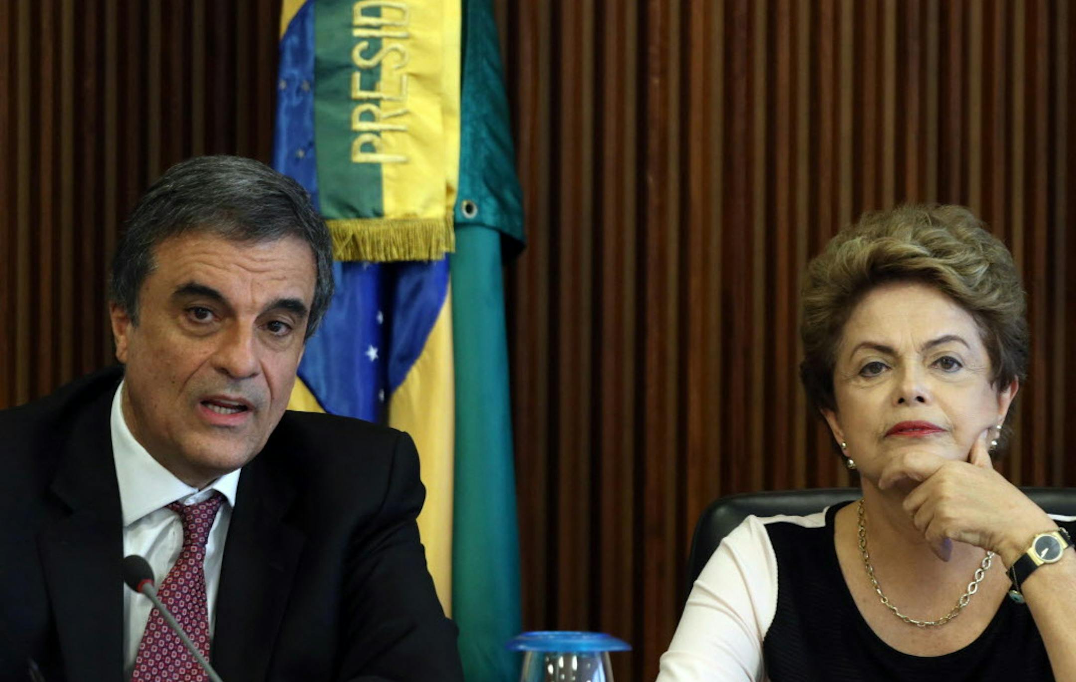 Brazil's President Dilma Rousseff, right, sits next to her Justice Minister Jose Eduardo Cardozo as they meat with a team of lawyers regarding impeachment proceedings against her at Planalto presidential palace, in Brasilia, Brazil, Monday, Dec. 7, 2015. On Monday, parties are expected to nominate representatives for a special commission in the lower house to determine whether impeachment proceedings will go to a full vote in the house. The proceedings were introduced last week, citing a court's
