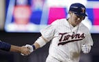 Minnesota Twins' Byung Ho Park, of South Korea, rounds the bases on a solo home off Miami Marlins starting Wei-Yin Chen during the sixth inning of a b