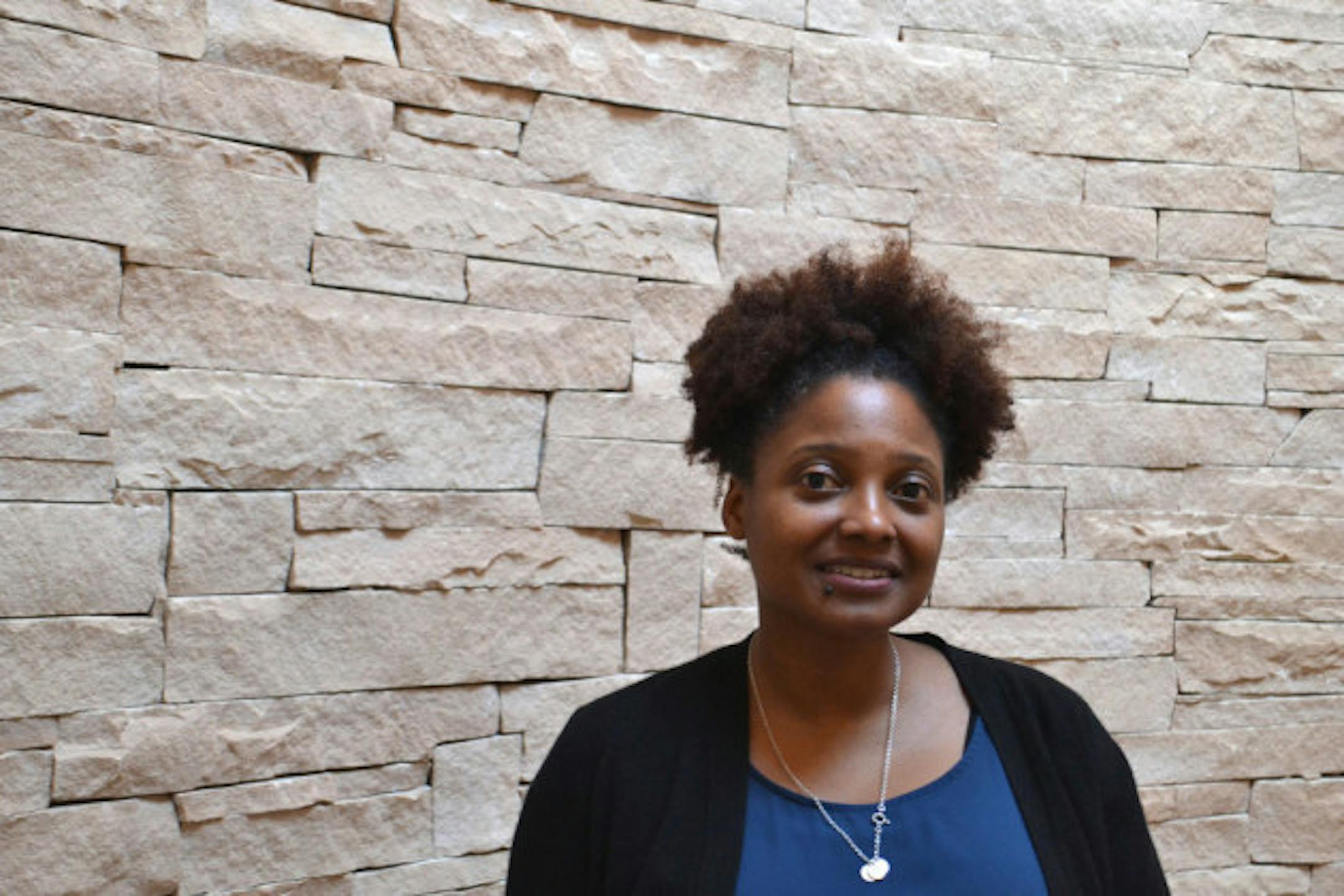 U.S. Poet Laureate Tracy K. Smith stands in a rotunda of the Santa Fe Indian School in Santa Fe, N.M., Friday, Jan. 12, 2018. Smith has embarked on the first of several trips to bring her poetry to rural pockets of the country where she says book festivals rarely take her. (AP Photo/Mary Hudetz). Tracy K. Smith