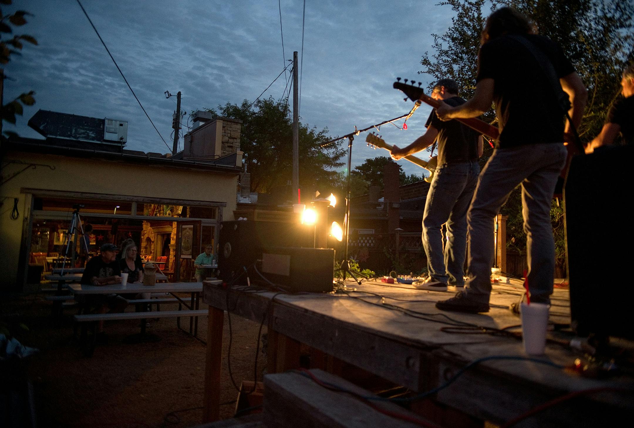 A small crowd gathers on the back patio of Bayport BBQ to watch Seattle band, GravelRoad play Tuesday, August 26. ] (SPECIAL TO THE STAR TRIBUNE/BRE McGEE) **GravelRoad (Seattle blues band), Bayport BBQ (restaurant)