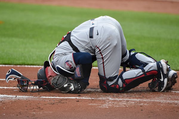 Twins catcher Mitch Garver was in pain after being struck by a foul tip on Tuesday in Baltimore.