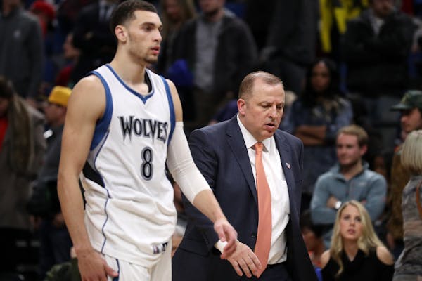 Minnesota Timberwolves guard Zach LaVine (8) and head coach Tom Thibodeau leave the court after the loss in overtime.