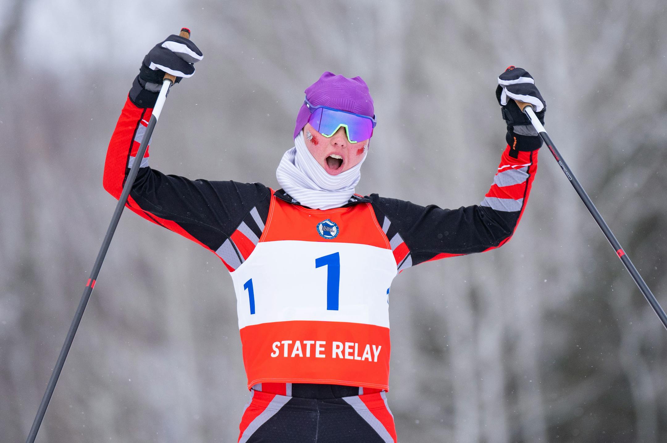 Duluth East nordic skier Greta Hendrickson (1) celebrates as she crosses the finish line to take first place in the girl's team sprint final during the MSHSL Boys and Girls Nordic Ski Racing Meet.