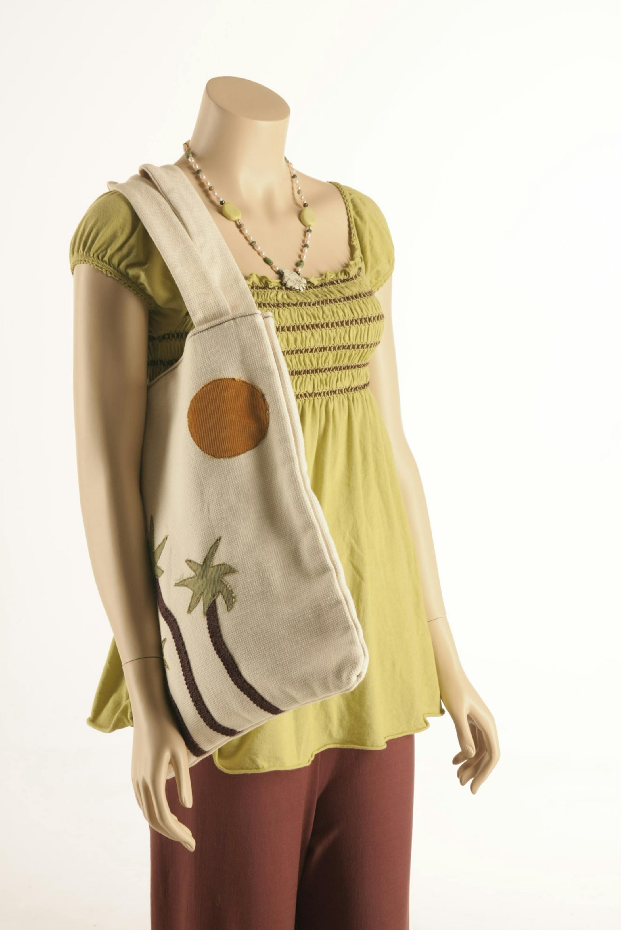 Locally-made Foat Designs pants and Julz Marie tote bag. Green by Green Dragon shirt.