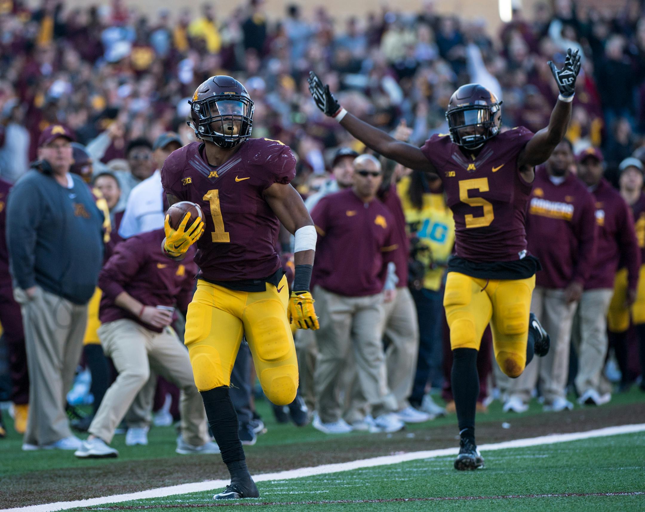 Minnesota Golden Gophers running back Rodney Smith (1) ran in for a touchdown off a kickoff return as Minnesota Golden Gophers wide receiver Melvin Holland Jr. celebrated following close behind in the third quarter against Rutgers Saturday. ] (AARON LAVINSKY/STAR TRIBUNE) aaron.lavinsky@startribune.com The University of Minnesota Golden Gophers football team played the Rutgers Scarlet Knights on Saturday, Oct. 21, 2016 at TCF Bank Stadium in Minneapolis, Minn.