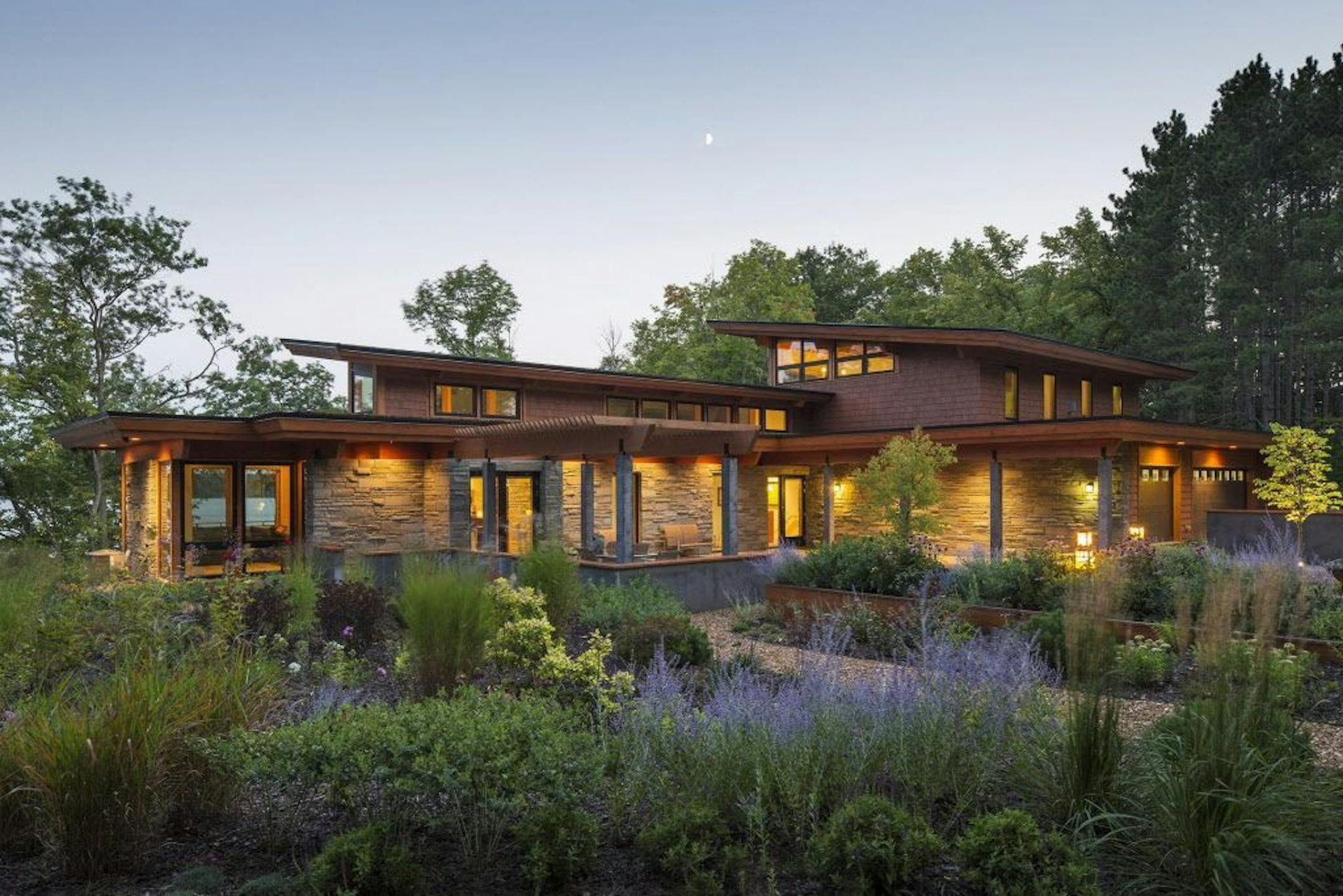 This modern interpretation of a prairie-style home features a pop-up roof with clerestory windows; by Katherine Hillbrand, SALA Architects.
