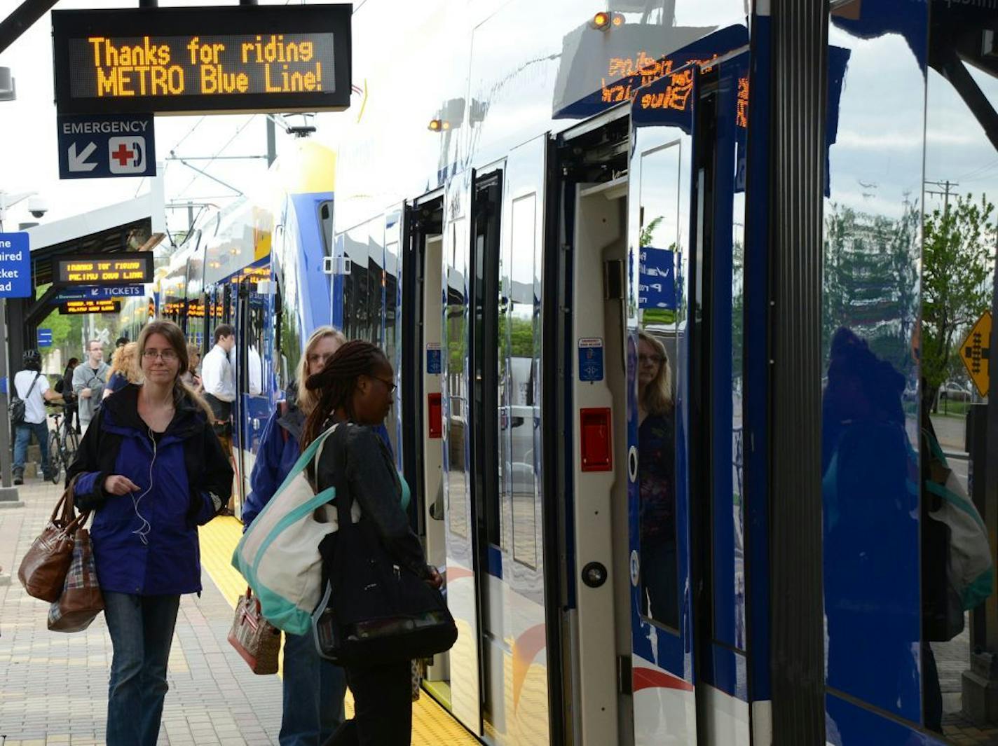 The Hiawatha Light Rail Line is being rebranded as the METRO Blue Line. The Blue Line is the first of the Twin Cities METRO system of rapid transit lines which include METRO Red Line Bus Rapid Transit on Cedar Ave. METRO Blue Line trains will now have three cars and will run every ten minutes throughout most of the day. Twelve new light-rail vehicles dedicated to the line will allow this increased service capacity. During the kickoff event Metro Transit staff handed out Blue line pens, new sched