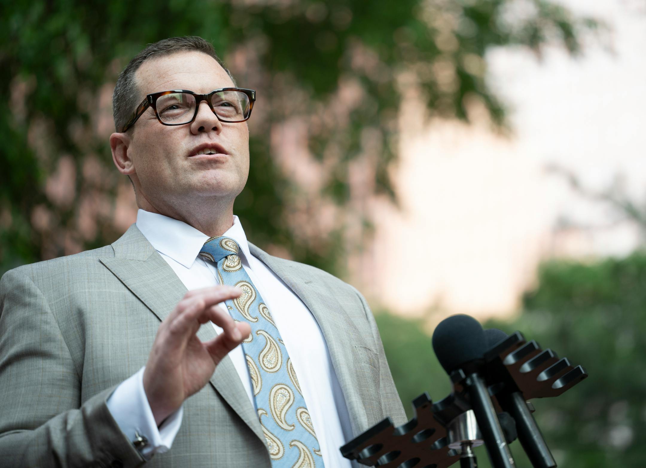 Civil rights attorney Jeff Storms speaks to the media during a rally outside the Hennepin County Government Center Friday, June 16, 2023, in Minneapolis, Minn. The US Department of Justice released the findings in its sweeping investigation into the Minneapolis Police Department finding it routinely engaged in a pattern of racist and abusive behavior.
