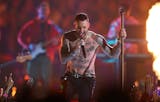 Maroon 5's Adam Levine goes shirtless during the Super Bowl LIII Halftime Show on Sunday at Mercedes-Benz Stadium in Atlanta.