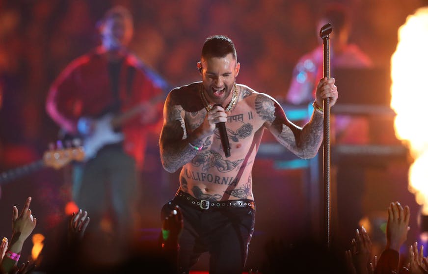 Maroon 5's Adam Levine goes shirtless during the Super Bowl LIII Halftime Show on Sunday at Mercedes-Benz Stadium in Atlanta.
