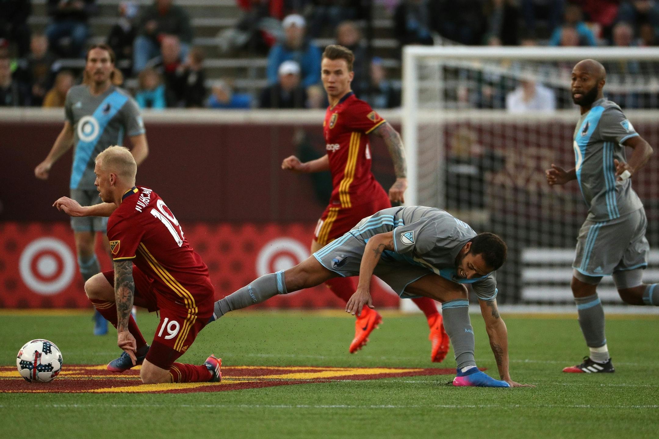 Minnesota United midfielder Ibson (7) went down after colliding with Real Salt Lake midfielder Luke Mulholland (19) as they fought for the ball in the first half.
