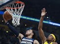 Wolves guard Tyus Jones drove for a layup past Pacers center Myles Turner in the first half Sunday.