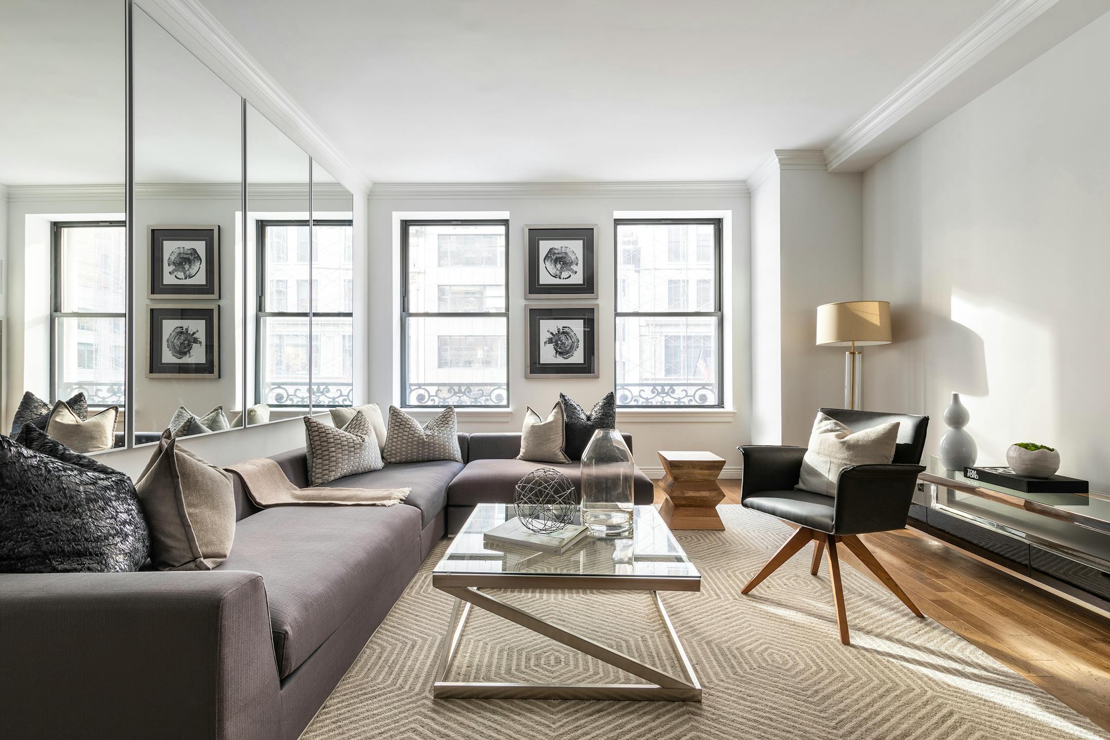 Pairing warm neutrals with black feels cozy in this living space. (Handout/TNS)