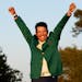 Hideki Matsuyama, of Japan, celebrates after putting on the champion's green jacket after winning the Masters golf tournament on Sunday, April 11, 202