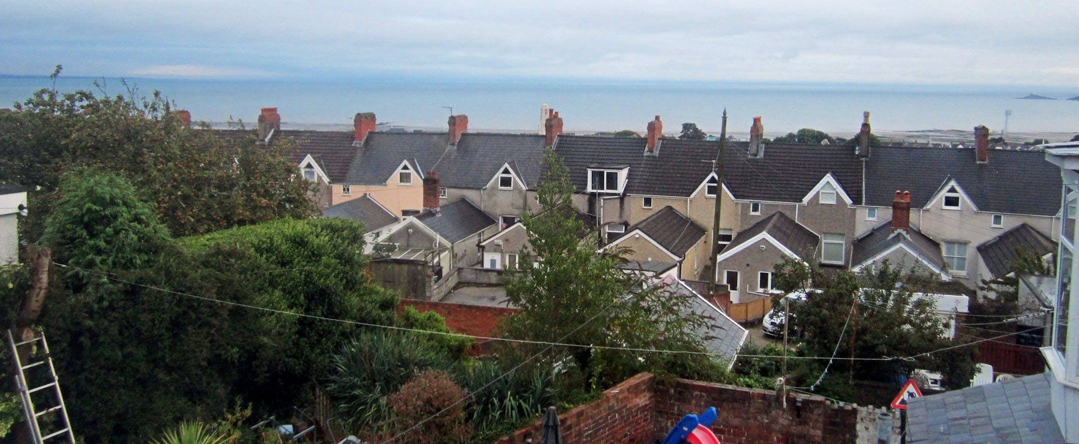 In one of his letters, Dylan Thomas wrote about ships sailing over rooftops. The view of Swansea Bay from his parentsí bedroom in Swansea, Wales may be where he got the idea. Interestingly, the window was boarded up for years and only recently rediscovered and restored. (Bill Hageman/ Chicago Tribune/MCT) ORG XMIT: 1147151