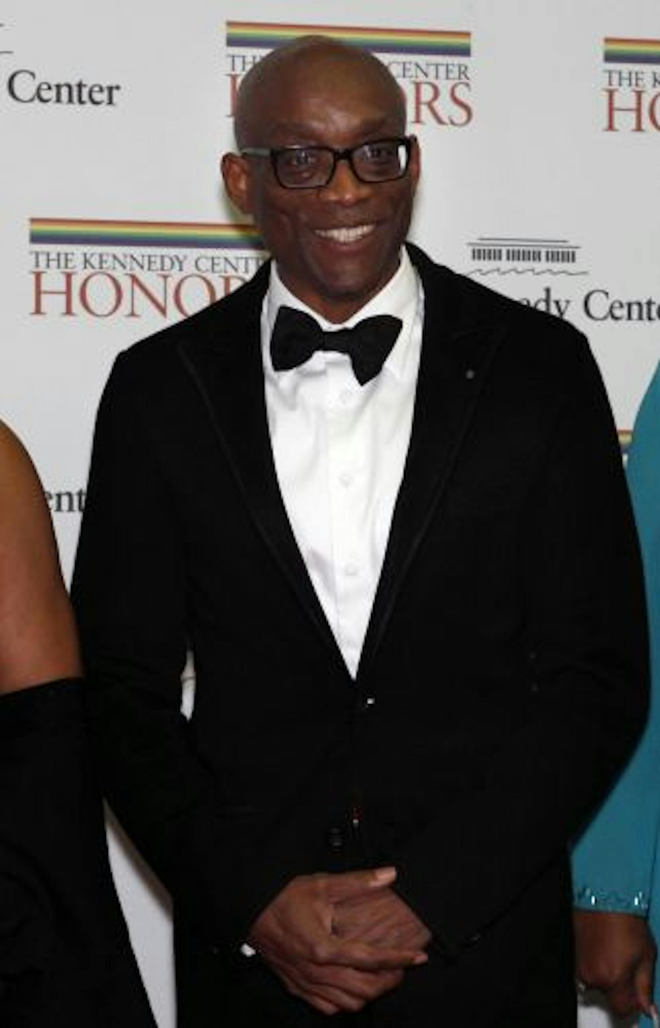 Bill T. Jones poses on the red carpet on arrival at a dinner held at the State Department honoring the recipients of the Kennedy Center Honors, in Washington, on Saturday, Dec. 4, 2010. The honorees are Jones, Merle Haggard, Jerry Herman, Paul McCartney, and Oprah Winfrey.