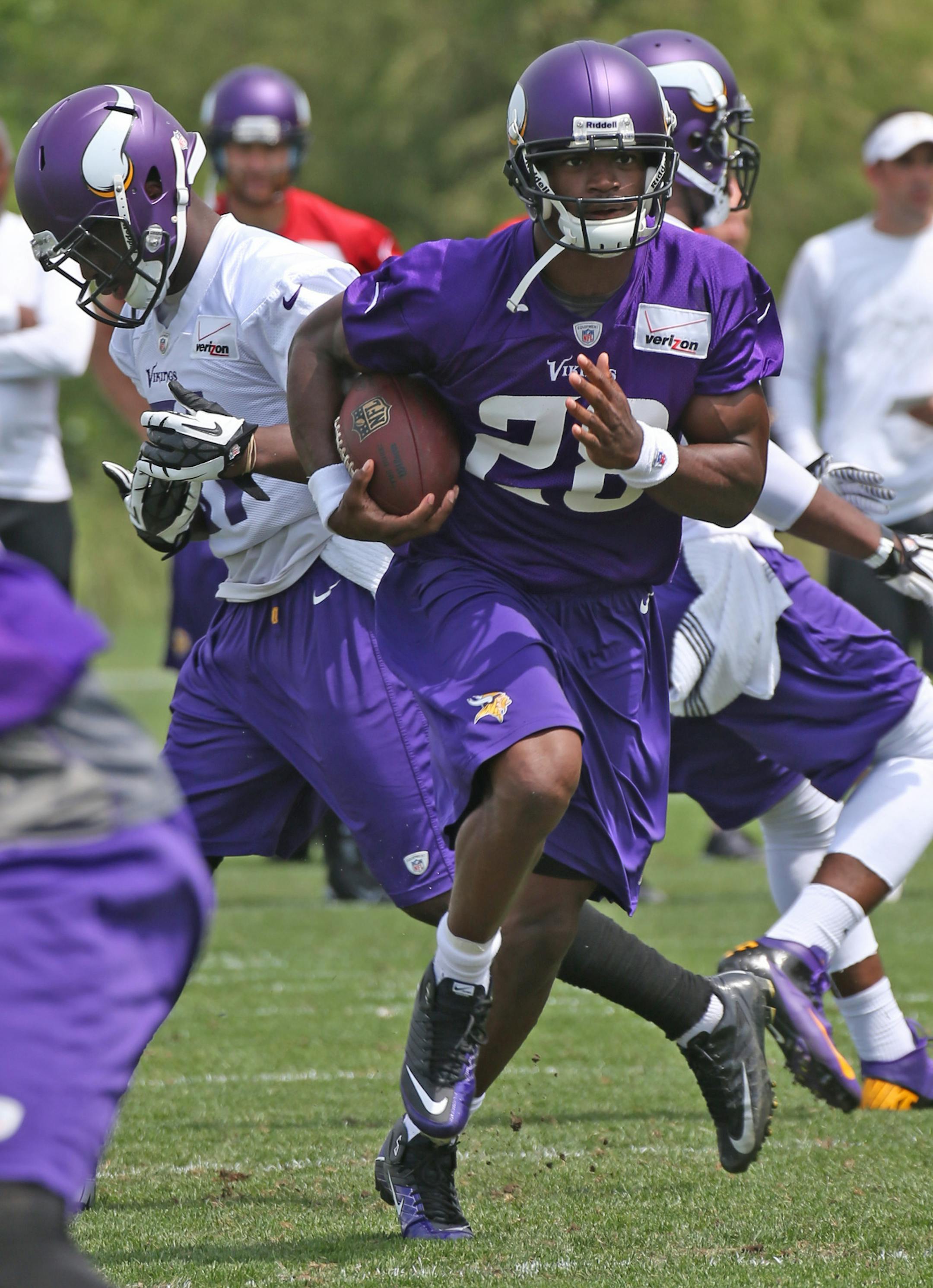 Vikings Adrian Peterson ran with the ball during the 3rd day of Vikings mini-camp at Winter Park on 6/20/13.] Bruce Bisping/Star Tribune bbisping@startribune.com Adrian Peterson/roster.