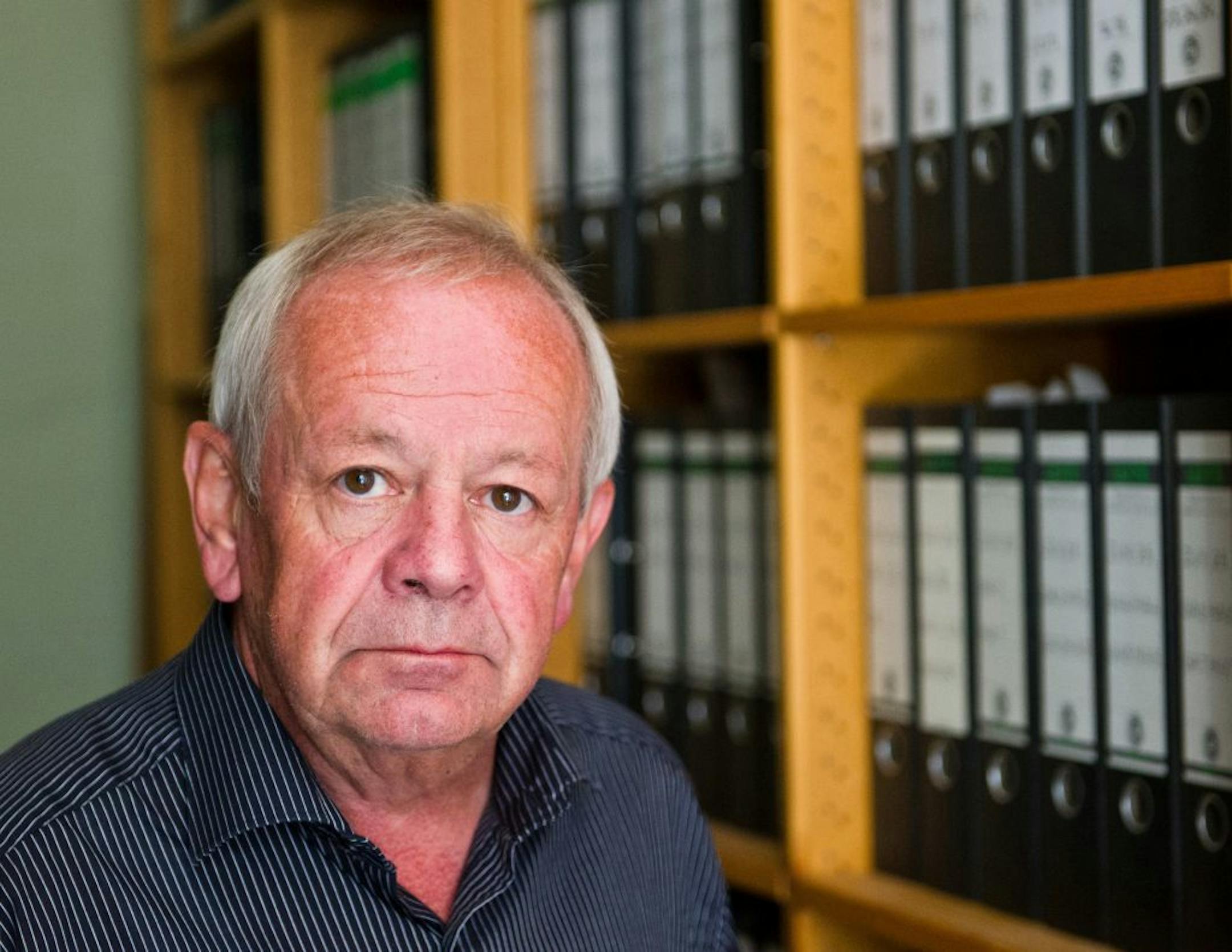 The head of Ludwigsburg federal prosecutors office, Kurt Schrimm stands in his office in Ludwigsburg, Germany.