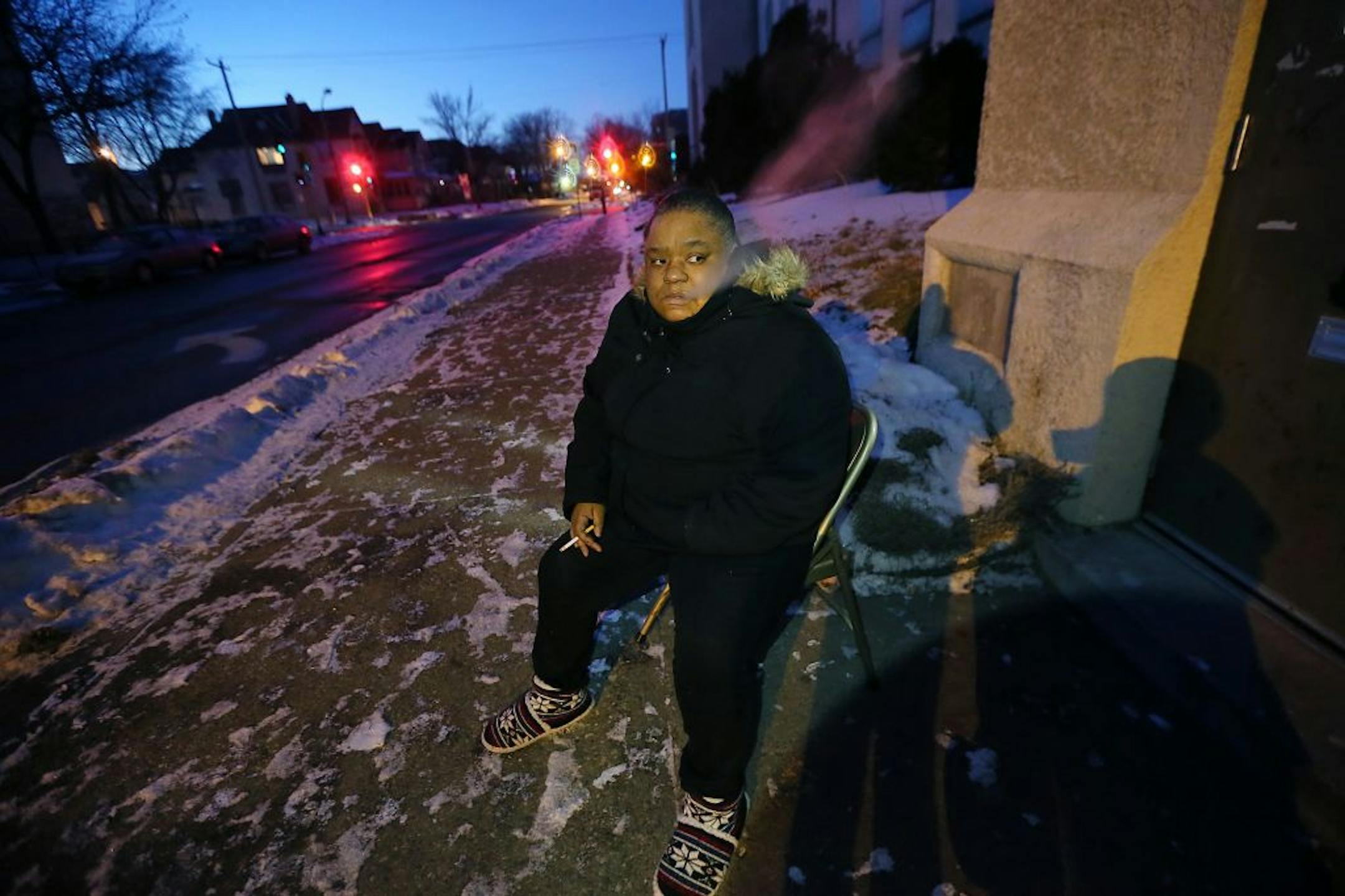 Mandisha Kelley braved the frigid temperatures to smoke outside the Simpson Housing Shelter, Friday, February 12, 2016 in Minneapolis, MN.