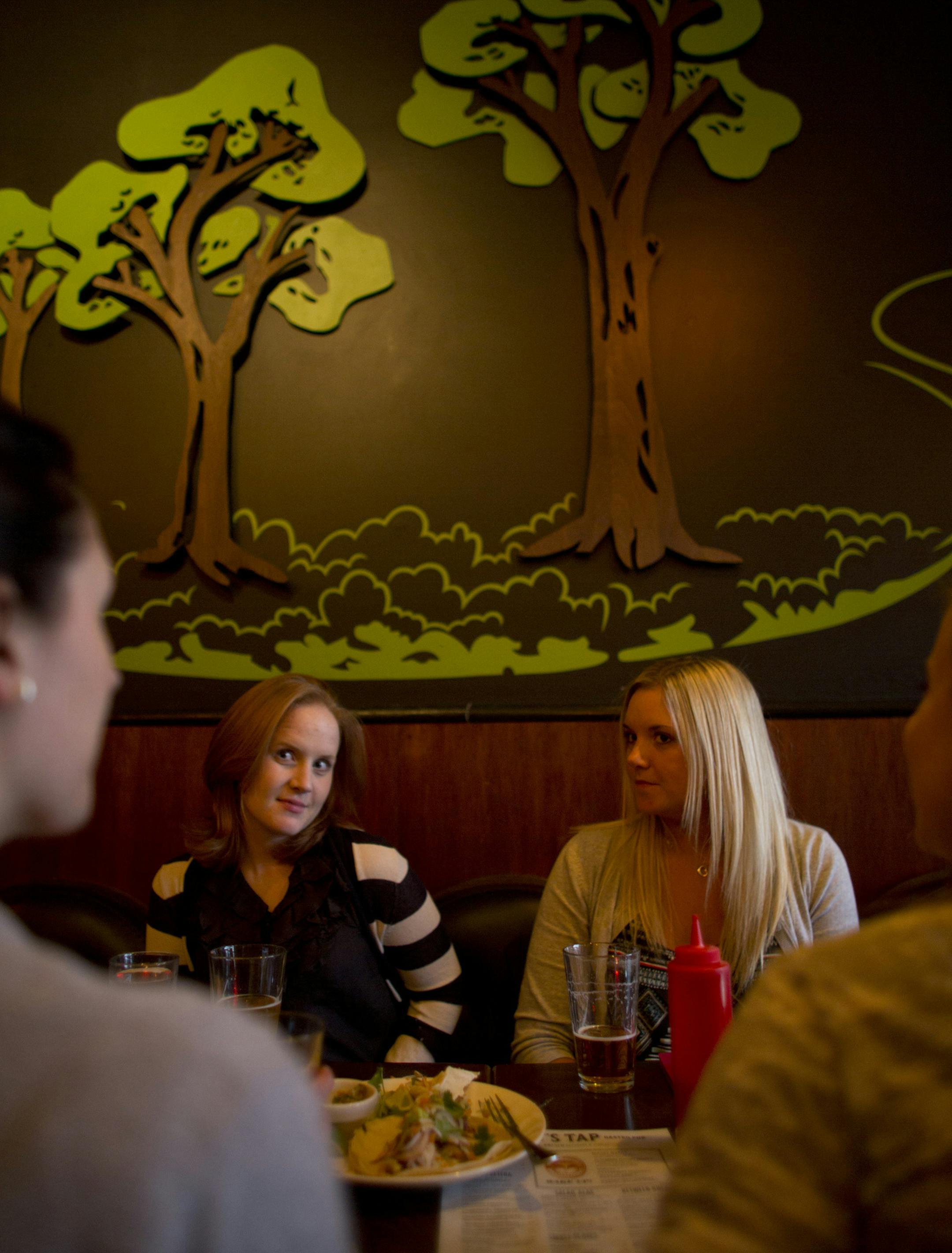 Minneapolis officials are tackling a 30-year-old rule that requires most of the city's bars to make 60 percent of their revenues from food. It's known around City Hall as the "60-40" rule. Keeping up with those ratios is particularly tough for businesses in Uptown, which has a thriving nightlife scene. Two city council members hope a change to 50-50 will ease the burden. Pat's Tap at 36th St. and Nicollet Ave. S. in Minnneapolis, Minn. does a robust business in food. Catherine Byrd, left, and Li