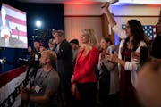 Leslie Larson, in red, was emotional as Republican candidate Scott Jensen spoke without conceding to Gov. Tim Walz at the GOP election night party Tue